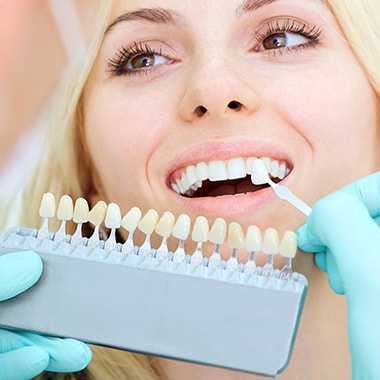 A patient getting teeth whitening 
